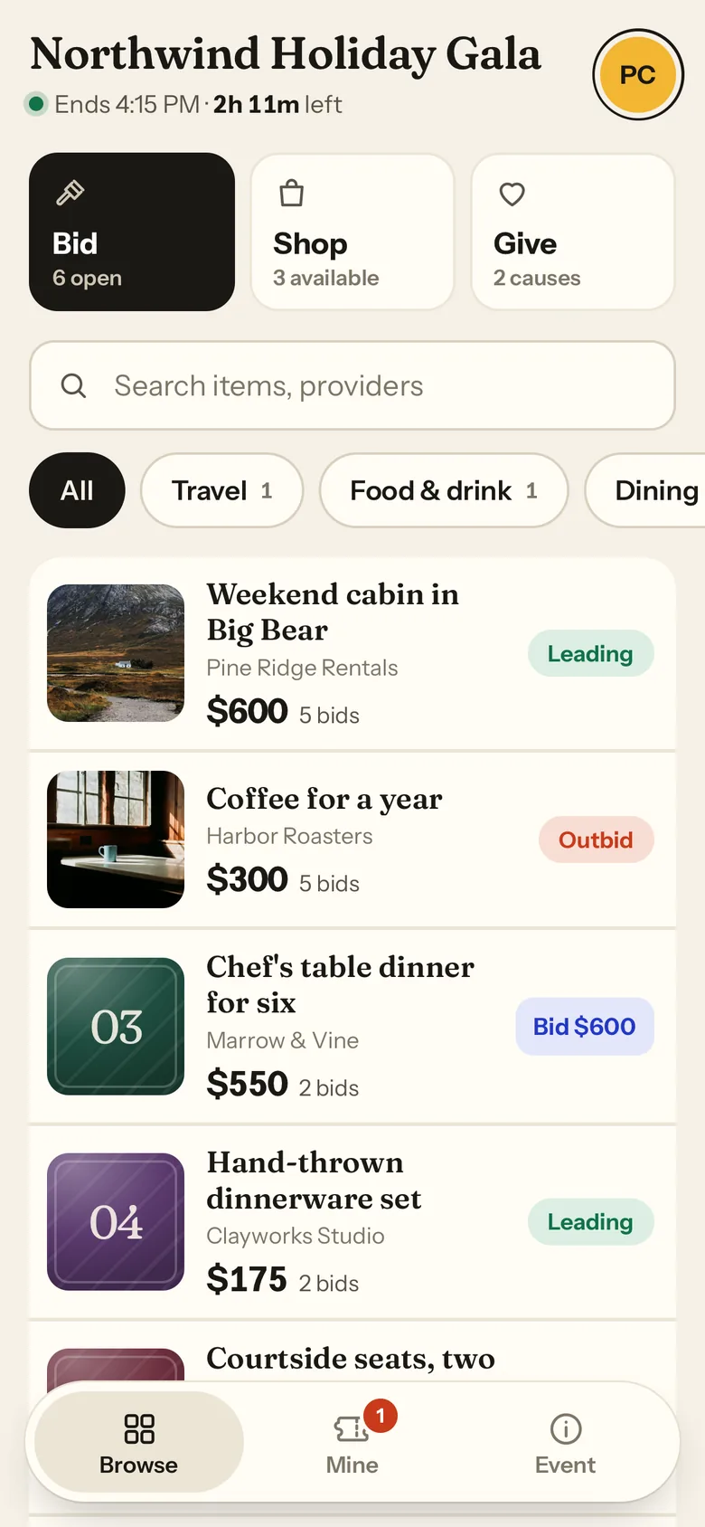 A guest's phone showing the auction items, with Leading and Outbid status on their bids.